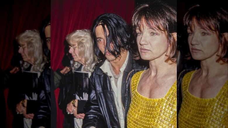 Johnny Depp and Ellen Barkin walking together 