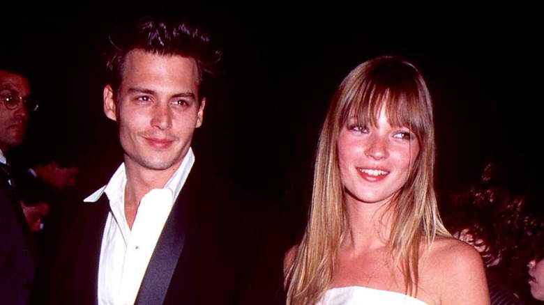 Johnny Depp and Kate Moss smiling