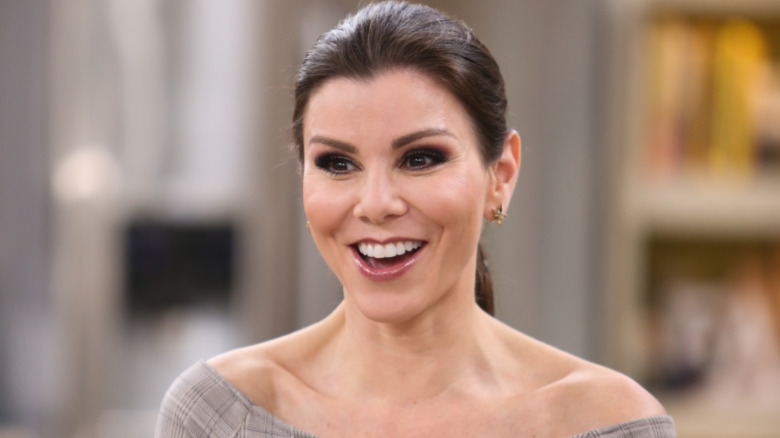 Heather Dubrow smiling on a TV appearance