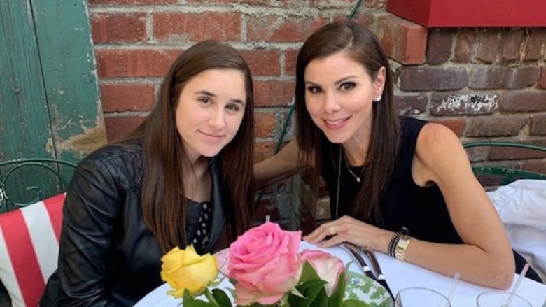 Max Dubrow and Heather Dubrow smiling at a restaurant