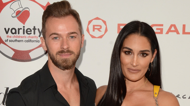 Artem Chigvintsev and Nikki Bella pose together