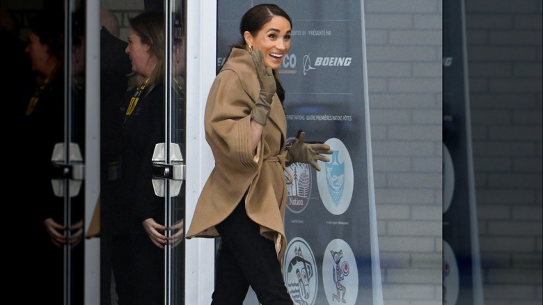 Meghan Markle waving while outside