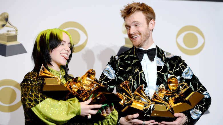 Billie Eilish and Finneas O'Connell posing with Grammys