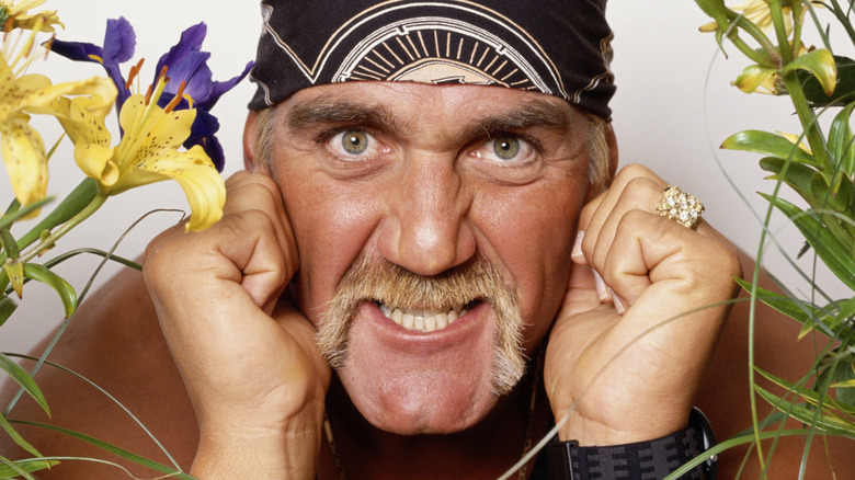 Hulk Hogan next to flowers