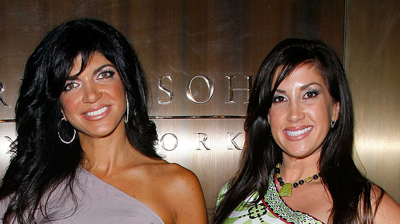 Teresa Giudice and Jacqueline Laurita smile together at an event