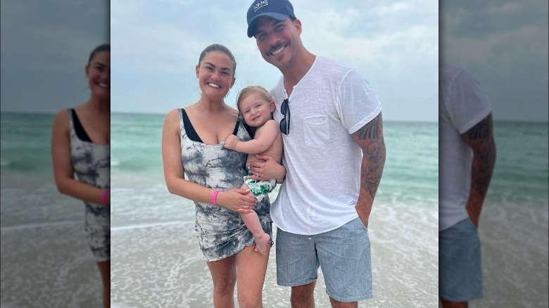 Brittany Cartwright, Cruz Michael Cauchi, Jax Taylor posing for photo on the beach