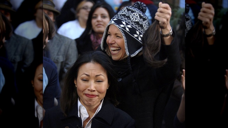 Katie Couric cutting Ann Curry's hair