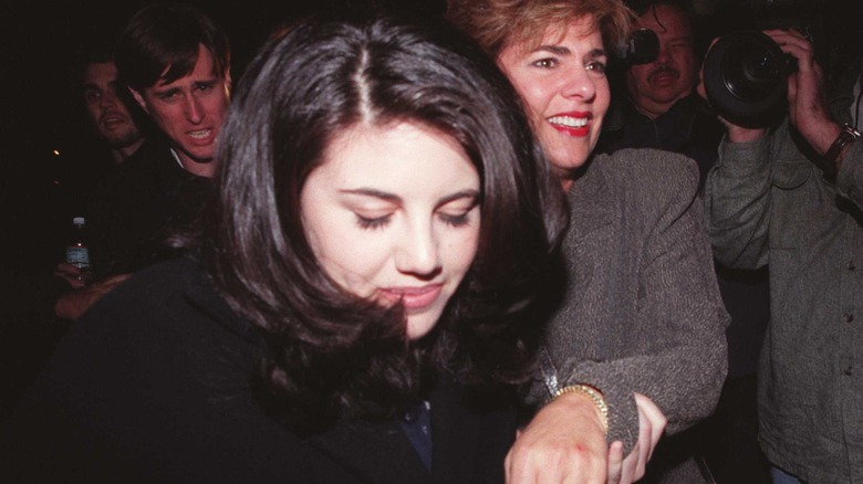 Monica Lewinsky fighting through a crowd in 1998