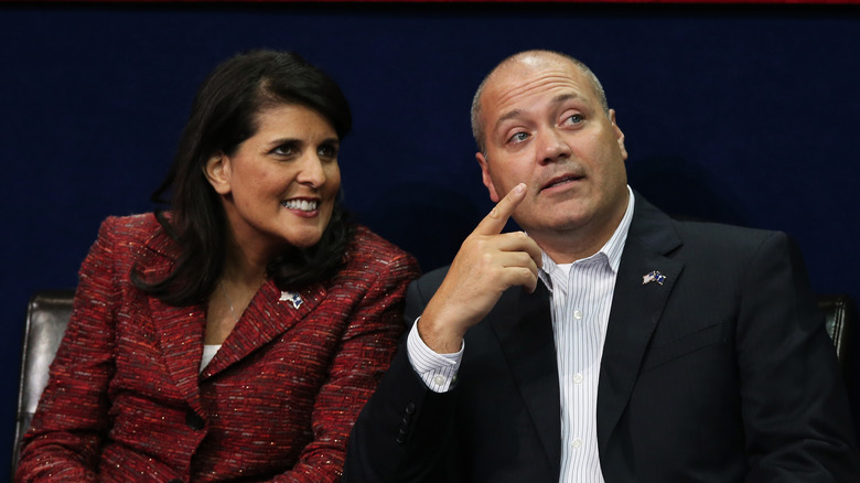 Nikki Haley talks with her husband