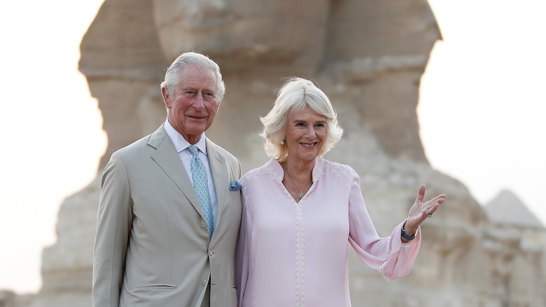 Prince Charles and Camilla Parker Bowles posing in front of the Sphinx in Cairo Nov. 2021