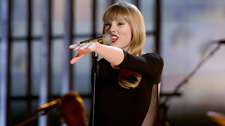 Taylor Swift singing with microphone