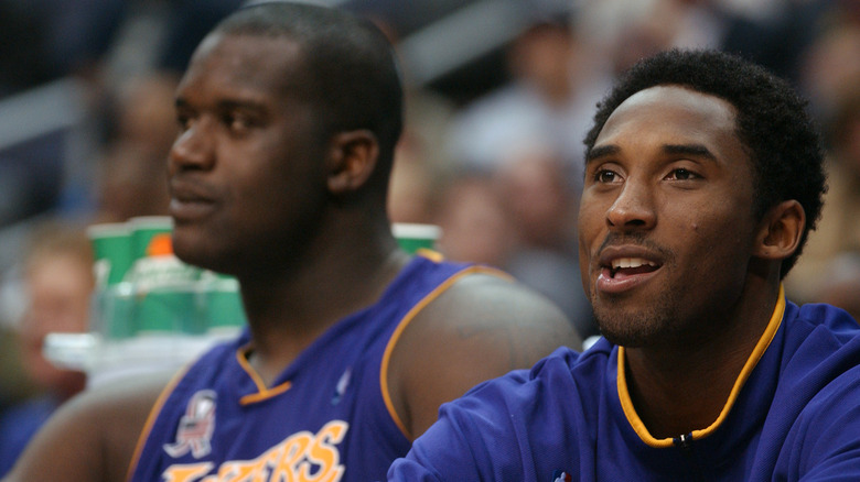 Kobe Bryant and Shaq O'Neal, sitting next to each other on the sidelines