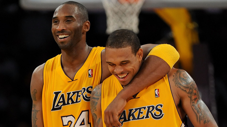 Kobe Bryant, holding Shannon Brown