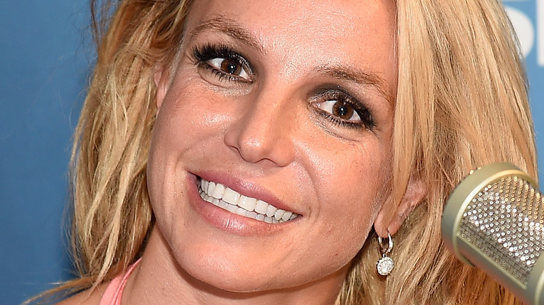 Britney Spears smiling with microphone