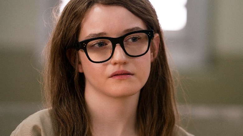 Julia Garner black glasses and long red hair