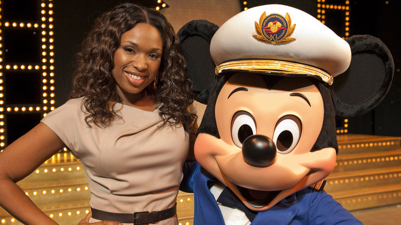 Jennifer Hudson posing with Mickey Mouse