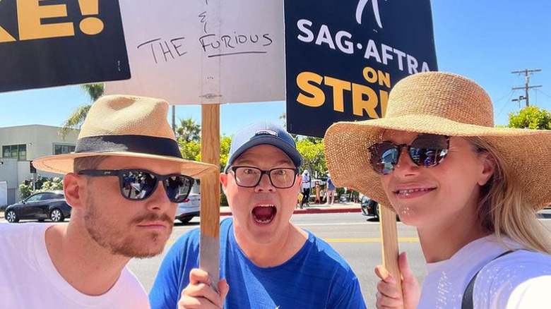 Jesse Lee Soffer and Tracy Spiridakos picketing