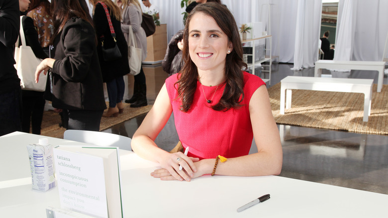 Tatiana Schlossberg sitting at a table