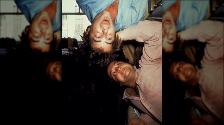 Jim and John Belushi making goofy faces.