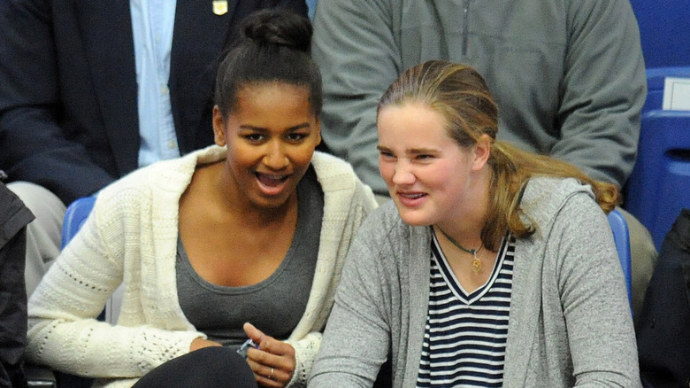 Sasha Obama and Maisy Biden watching intently