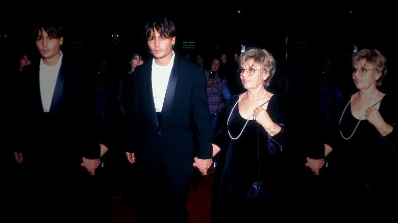 Johnny Depp holds hands with his mother