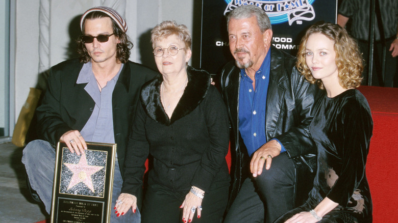 Johnny Depp poses with his parents and Vanessa Paradis