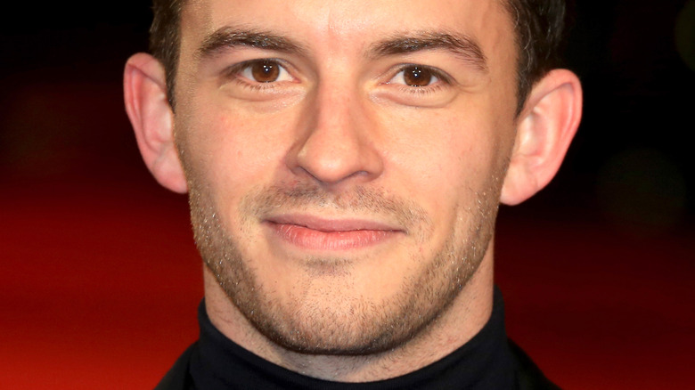 Jonathan Bailey smiles