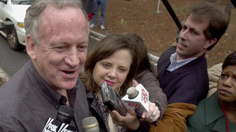 John Ramsey and Patricia Ramsey speak to the media outside their home in Atlanta, GA (2001)