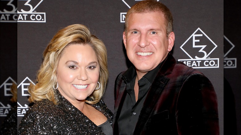 Julie and Todd Chrisley posing together 