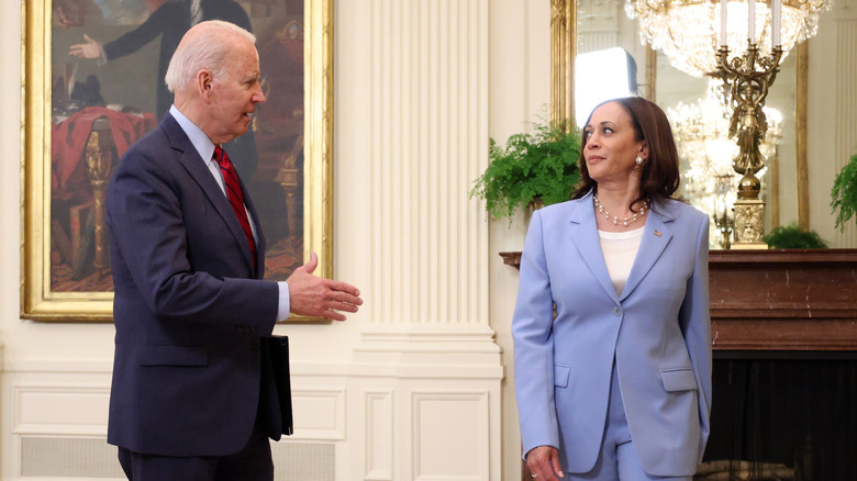 Joe Biden talking to Kamala Harris in the White House