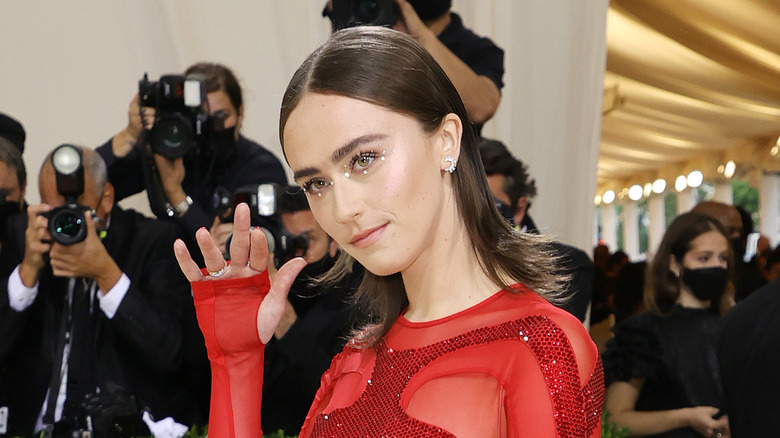 Ella Emhoff poses in red outfit