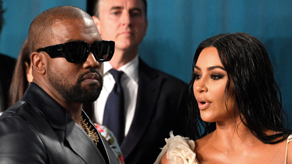 Kanye West and Kim Kardashian candid shot at an event