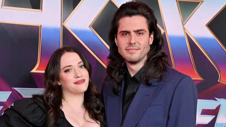 Kat Dennings smiling with Andrew W.K. on red carpet