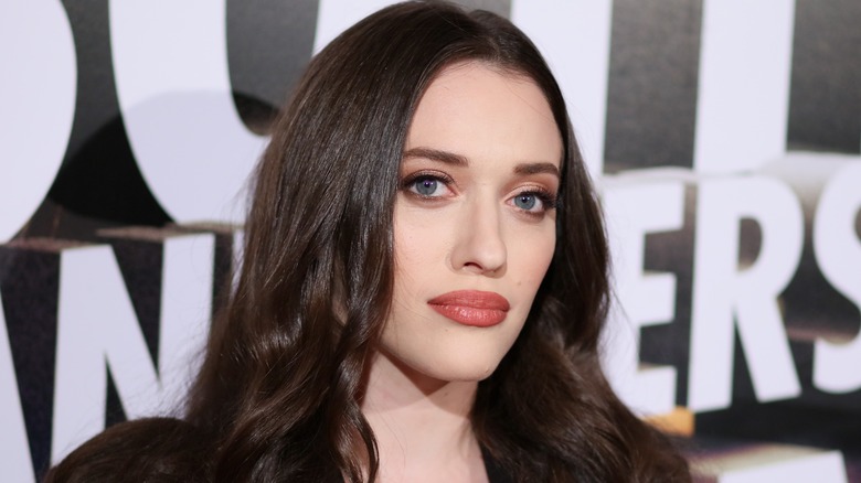 Kat Dennings posing on red carpet