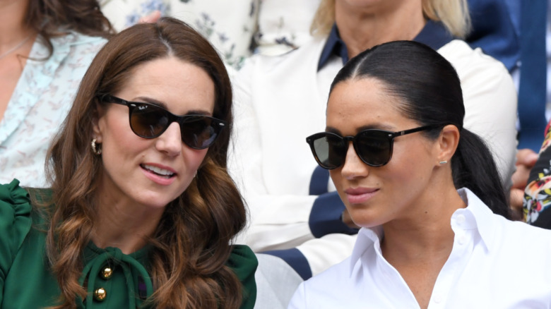 Kate Middleton and Meghan Markle talking