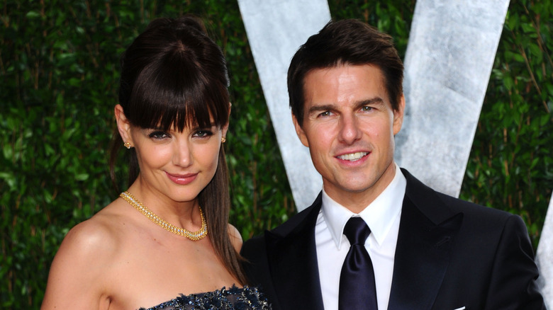 Katie Holmes and Tom Cruise smiling on the red carpet together