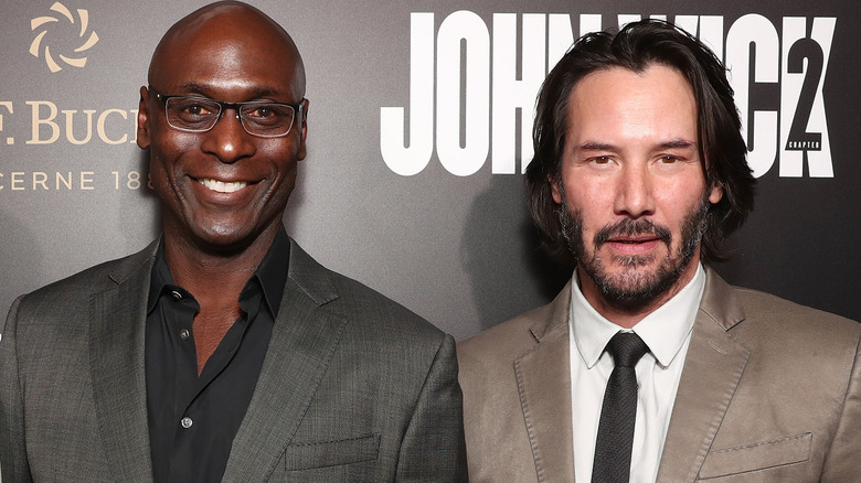 Lance Reddick and Keanu Reeves posing