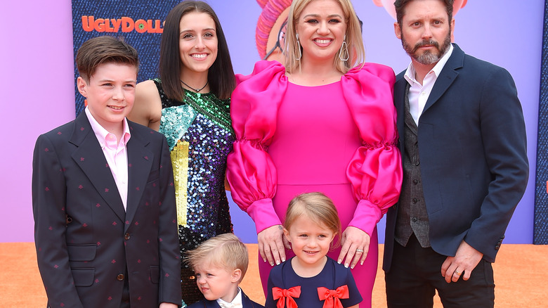 Smiling Kelly Clarkson and Brandon Blackstock and family  at "Ugly Dolls" 2019 in pink dress