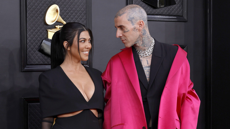 Kourtney Kardashian and Travis Scott smiling