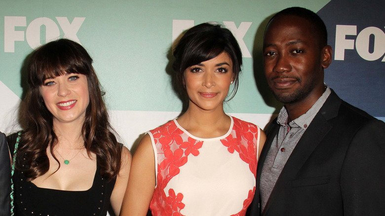 Zooey Deschanel, Hannah Simone and Lamorne Morris pose at an event