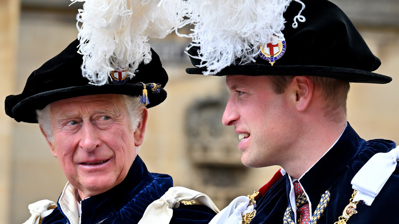 Prince William and King Charles III conversing