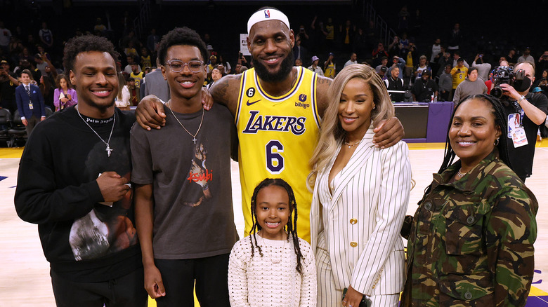 LeBron James poses with his wife, children and mother