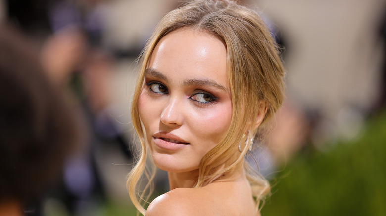 Lily-Rose Depp glancing over shoulder