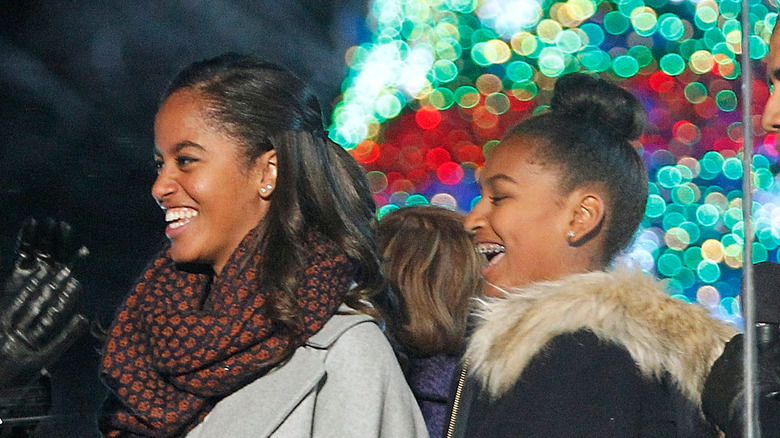 Sasha and Malia Obama at a Christmas ceremony