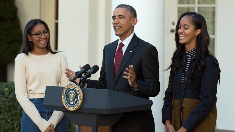 Malia and Sasha with Barack Obama at a turkey pardoning