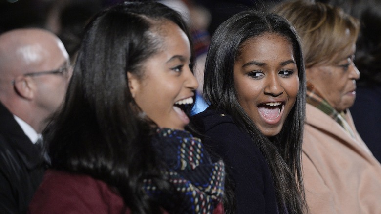 Sasha and Malia Obama smiling