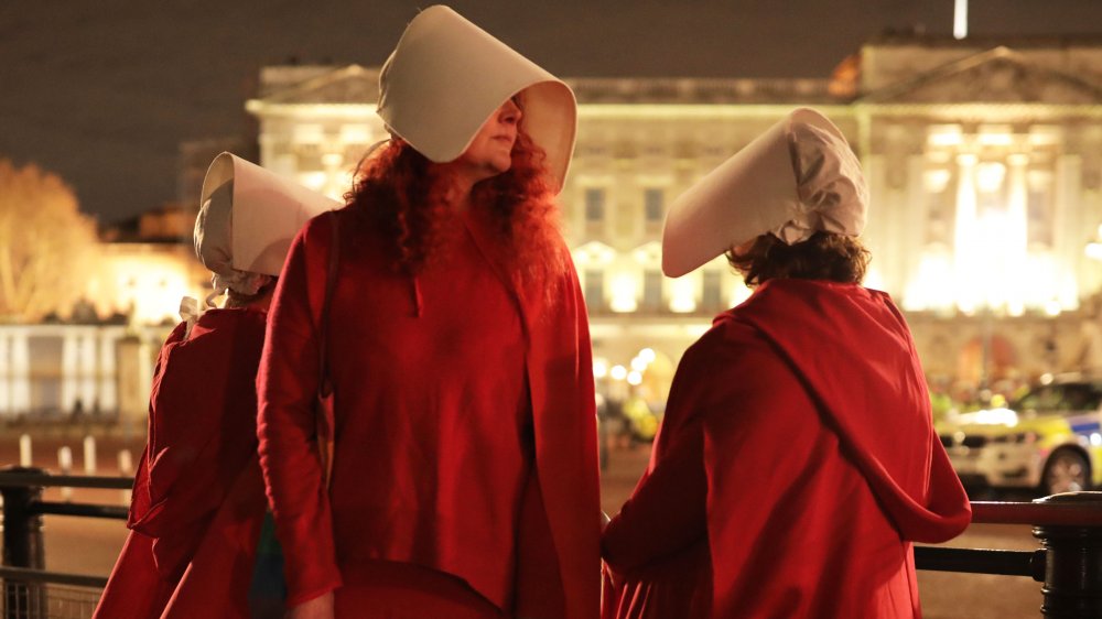 Protesters dressed as handmaids