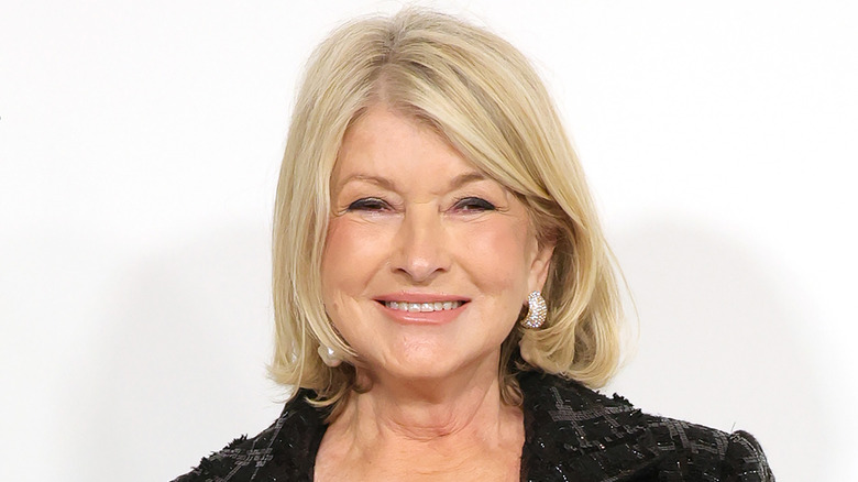 Martha Stewart smiles in a black, sequined jacket