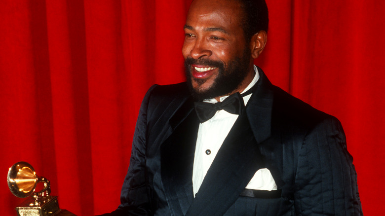 Marvin Gaye holding a Grammy statue 