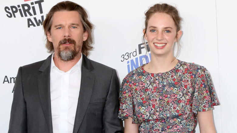 Maya Hawke smiling with Ethan Hawke